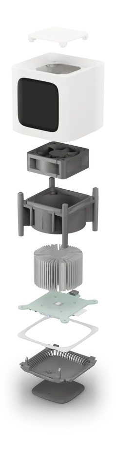 Every part of the Bitcube pulled apart, top cap to rubber foot