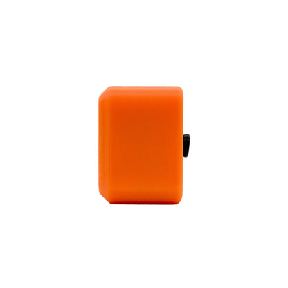 A bright orange rectangular electronic device with rounded corners and a small black side component, shown against a plain white background.