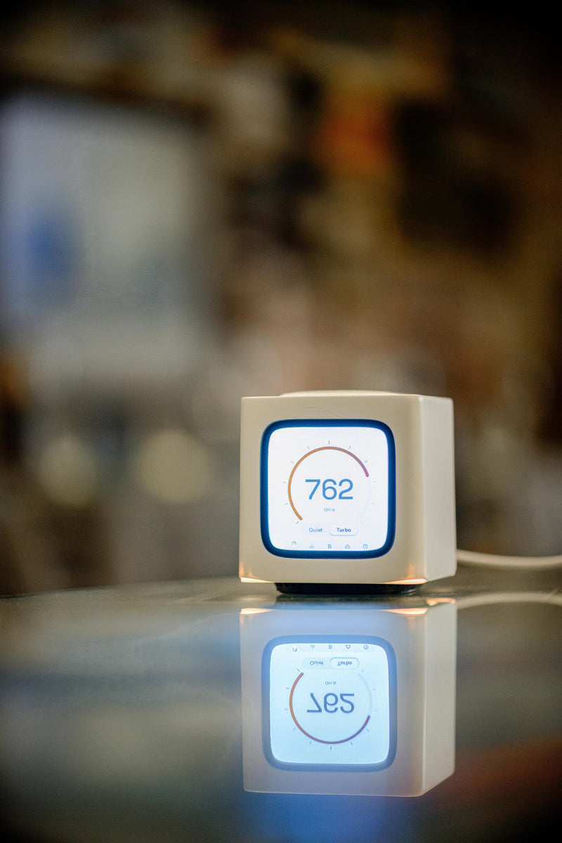 Bitcube reflected in a glossy table top